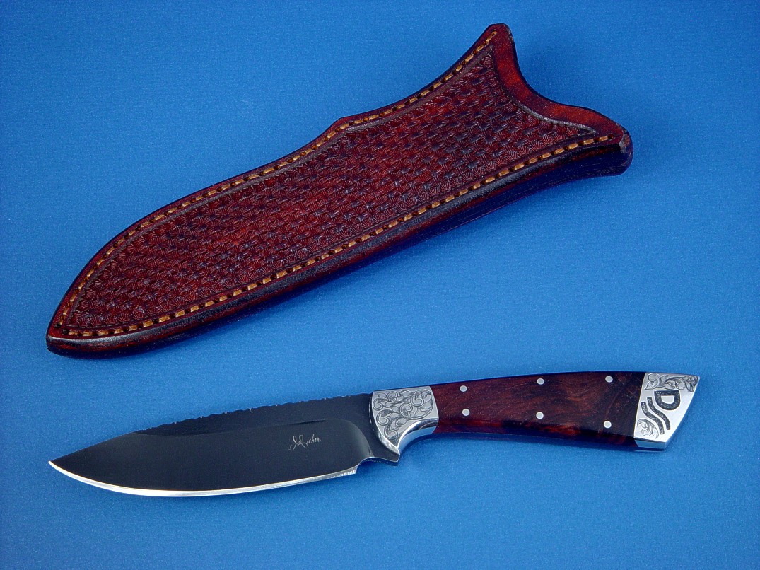 "Rio Grande" obverse side view in blued O1 high carbon tungsten-vanadium alloy tool steel blade, hand-engraved 304 stainless steel bolsters, Honduras Rosewood Burl hardwood handle, hand-stamped basket weave leather sheath