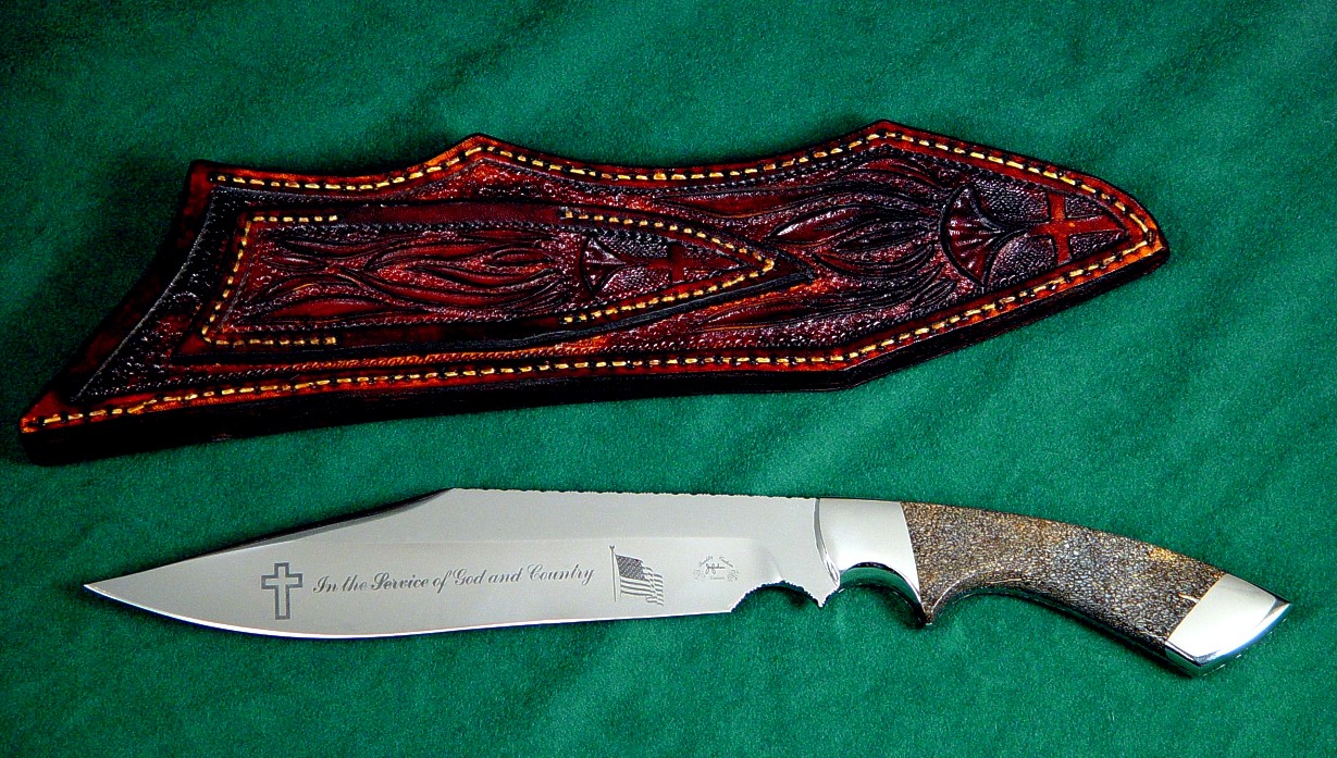 Veteran's knife honoring Major Thomas Shuman: veteran of three wars. Etched 440C high chromium stailess steel blade, 304 stainless steel bolsters, petrified dinosaur bone gemstone handle, hand-carved leather sheath