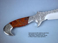 "Tribal" in hand-engraved 440C high chromium stainless steel blade, hand-engraved 304 stainless steel bolsters, Pilbara Picasso Jasper gemstone handle, sheath of hand-carved, hand-dyed leather shoulder, stand of 304 stainless steel, American black walnut, mesquite, lauan hardwoods, engraved black lacquered brass