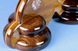 "Concordia" chef's knife, obverse side stand base detail. Rounded pillars of the base in American Black Walnut are stable and strong.