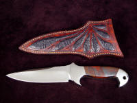 "Cygnus-Horrocks" custom handmade knife, obverse side view in 440C high chromium stainless steel blade, 304 stainless steel bolsters, Australian Tiger Iron gemstone handle, Ostrich leg skin inlaid in hand-carved leather shoulder