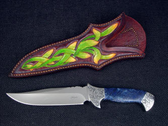 "Domovoi", obverse side view in ATS-34 high molybdenum stainless steel blade, hand-engraved 304 stainless steeel bolsters, African dumortierite gemstone handle, hand-carved, tooled, hand-dyed leather sheath