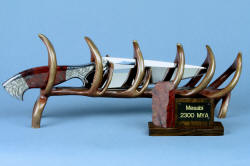 "Mesabi" custom knife sculpture in hand-cast bronze, 440C high chromium stainless steel blade, 304 hand-engraved stainless steel bolsters, Fossilized Stromatolite Chert gemstone