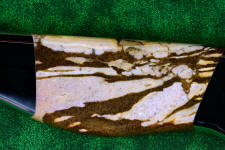 Brown zebra Jasper doesn't take a glassy finish, probably because it's a rhyolite